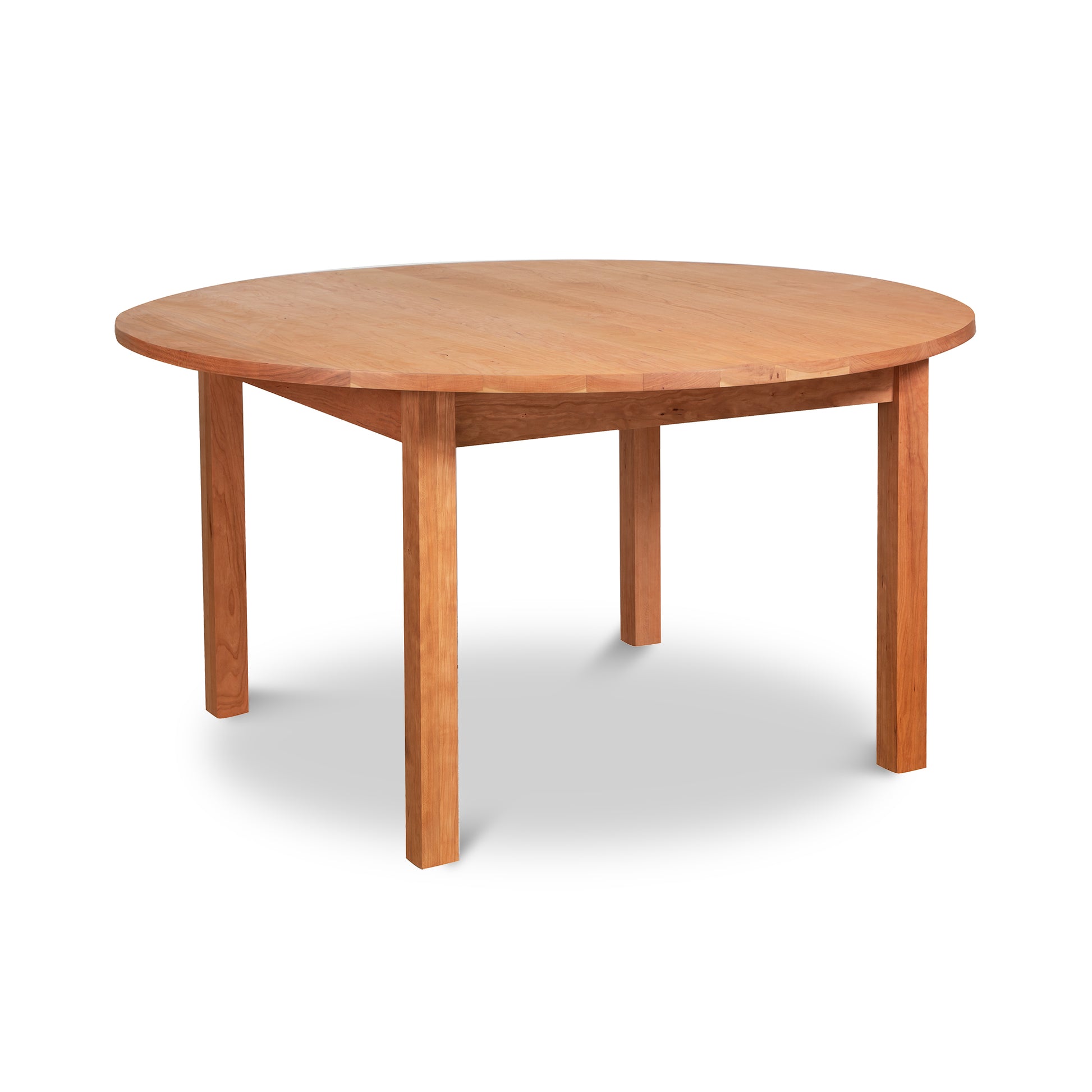 Burlington Shaker Round Solid Top Dining Table with smooth surface and sturdy four-leg support by Vermont Furniture Designs.