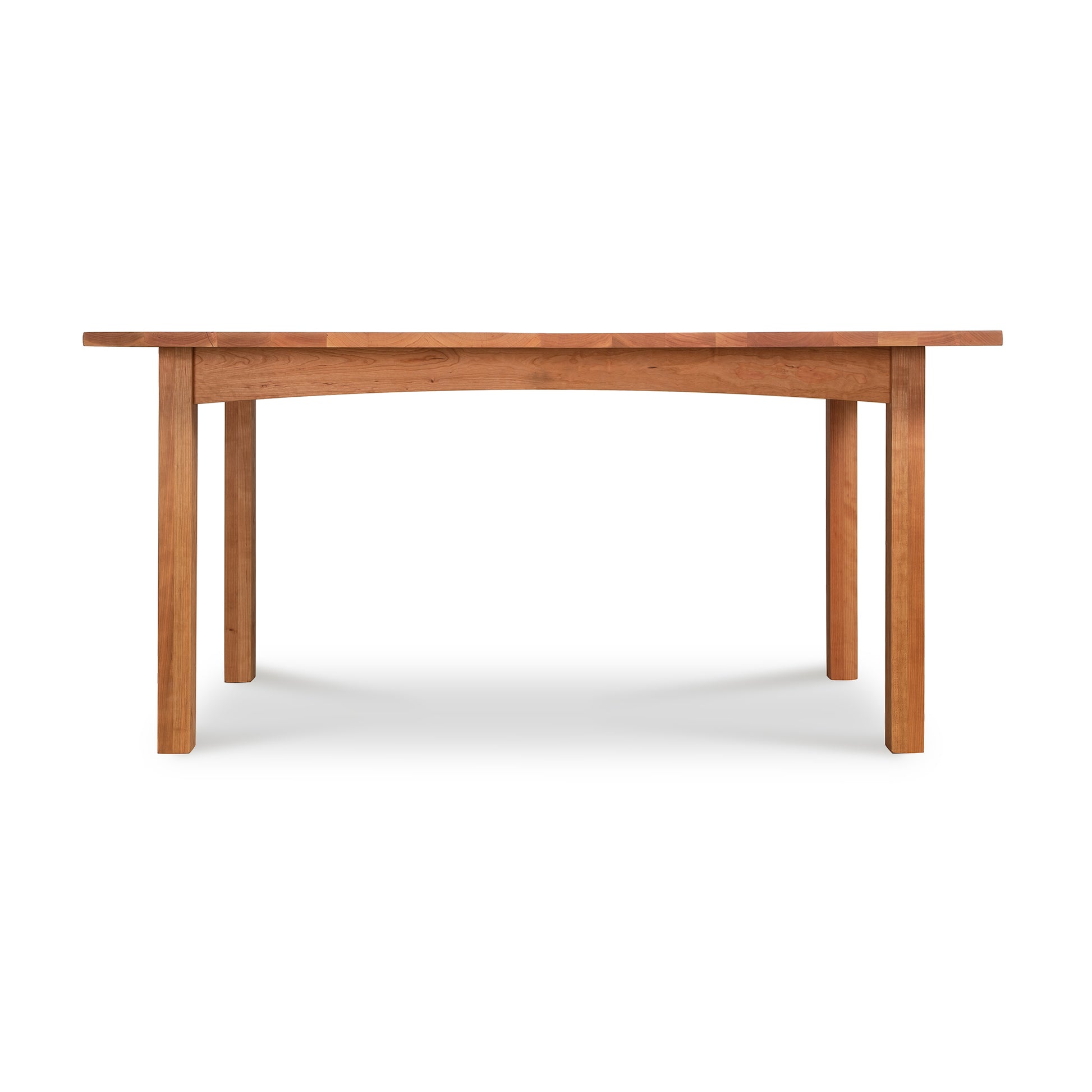 A Burlington Shaker Solid Top Dining Table by Vermont Furniture Designs with four legs on a white background.