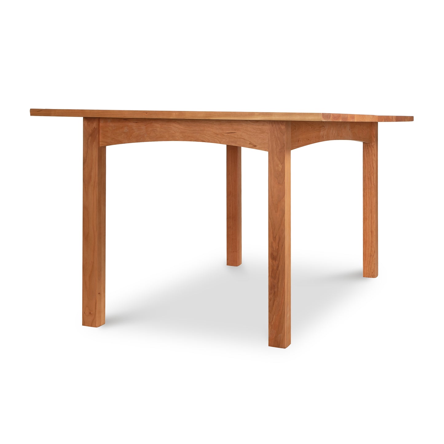 Wooden table with a simple design, featuring four straight legs and a smooth tabletop, isolated on a white background. This is known as the Vermont Furniture Designs Burlington Shaker Solid Top Dining Table.