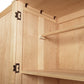 Burlington Shaker Tall Armoire in light wood grain with metal hinges, a bare rod, and shelf by Vermont Furniture Designs.