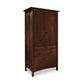 A handmade Burlington Shaker Tall Armoire by Vermont Furniture Designs with a cabinet section on top and three drawers at the bottom, isolated on a white background.