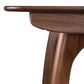 Copeland Butterfly Extension Dining Table in solid hardwood, showcasing fine wood grain details on legs and apron, American made craftsmanship.