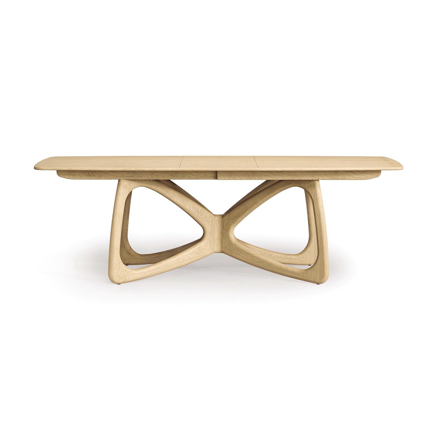 The Copeland Furniture's Butterfly Extension Dining Table boasts an elongated oval top and a complex, intersecting base design that captures modern aesthetics. Made from sustainably sourced hardwoods, this sophisticated table is showcased against a plain white background.