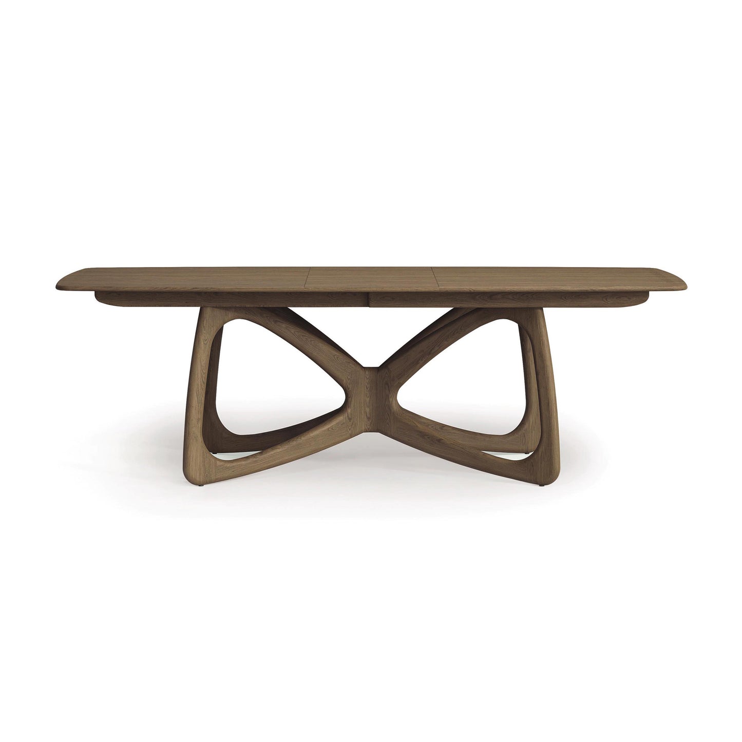 Introducing the Butterfly Extension Dining Table by Copeland Furniture—a stunning fusion of modern design and functionality. This piece features a rectangular tabletop with a sculptural X-shaped base, crafted from sustainably sourced hardwoods with a natural brown finish, making it an ideal embodiment of modern aesthetics against a plain white background.