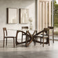 Copeland Butterfly Glass Top Dining Table with four hardwood chairs, showcasing modern design and fine craftsmanship.