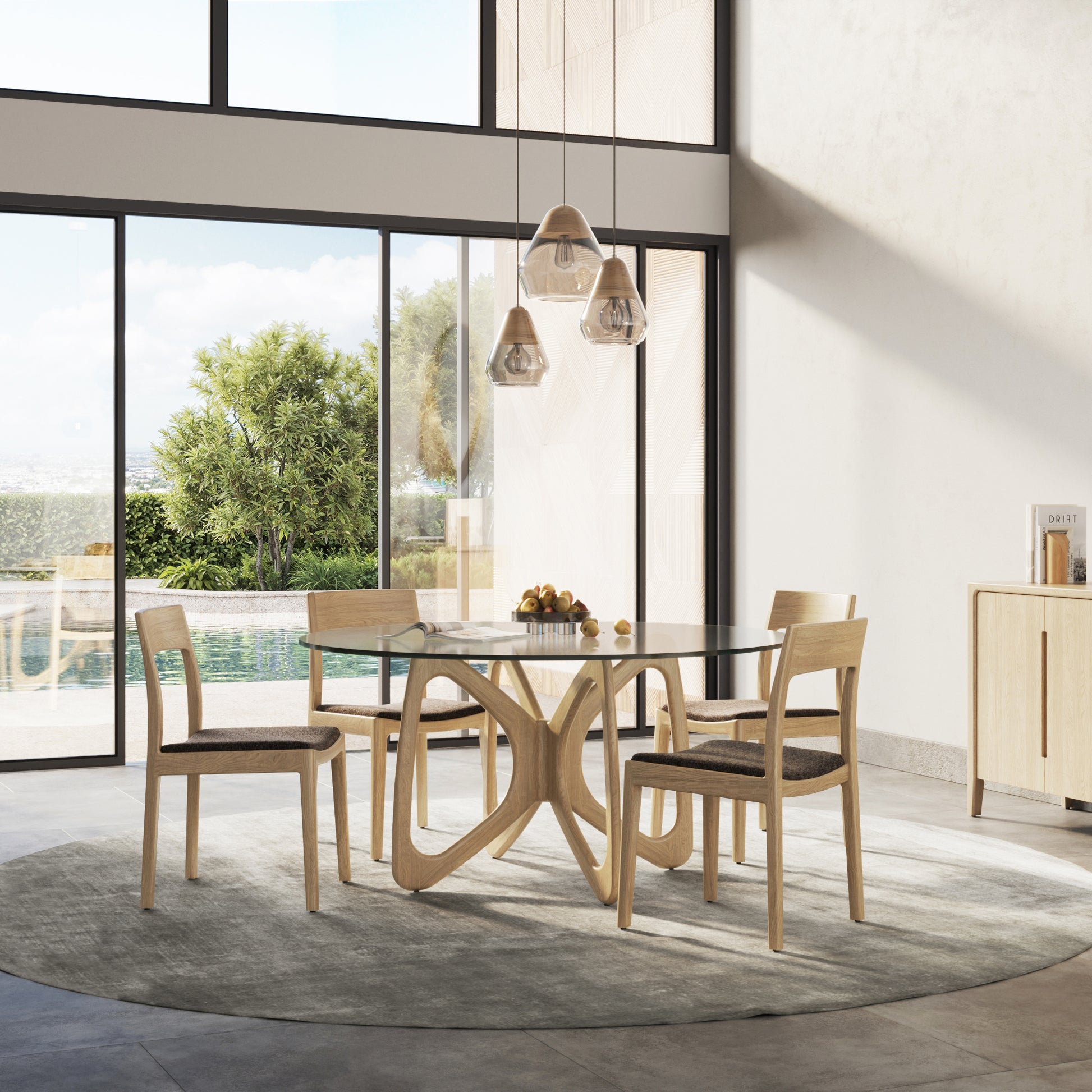 Copeland Furniture Butterfly Round Glass Top Table with four wooden chairs.