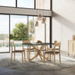 Copeland Furniture Butterfly Round Sintered Stone Top Table paired with wooden chairs.