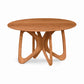 Copeland Furniture Butterfly Round Solid Top Dining Table with a sleek, seamless surface and four elegantly curved interlocking legs crafted in solid wood.