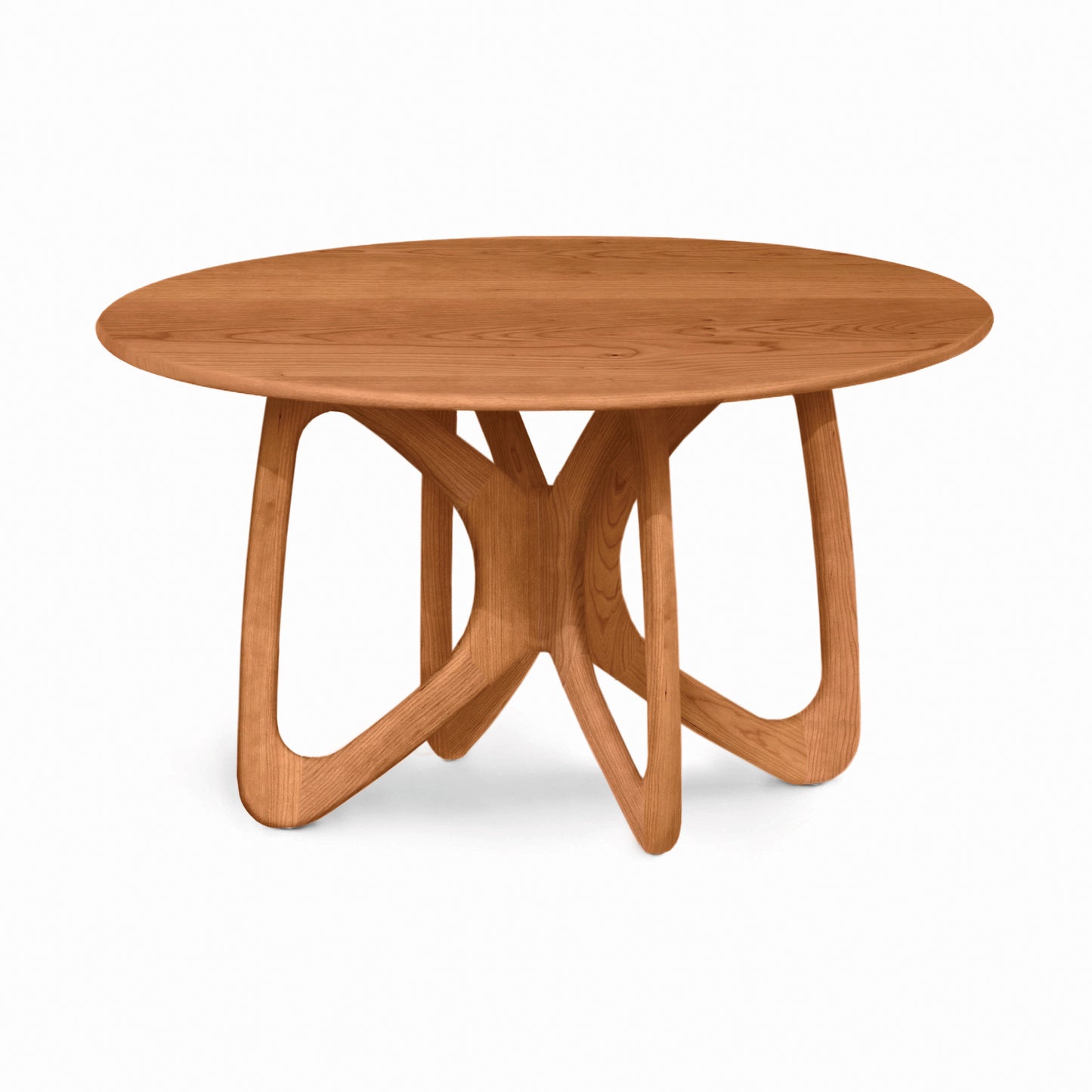 Copeland Furniture Butterfly Round Solid Top Dining Table with a sleek, seamless surface and four elegantly curved interlocking legs crafted in solid wood.