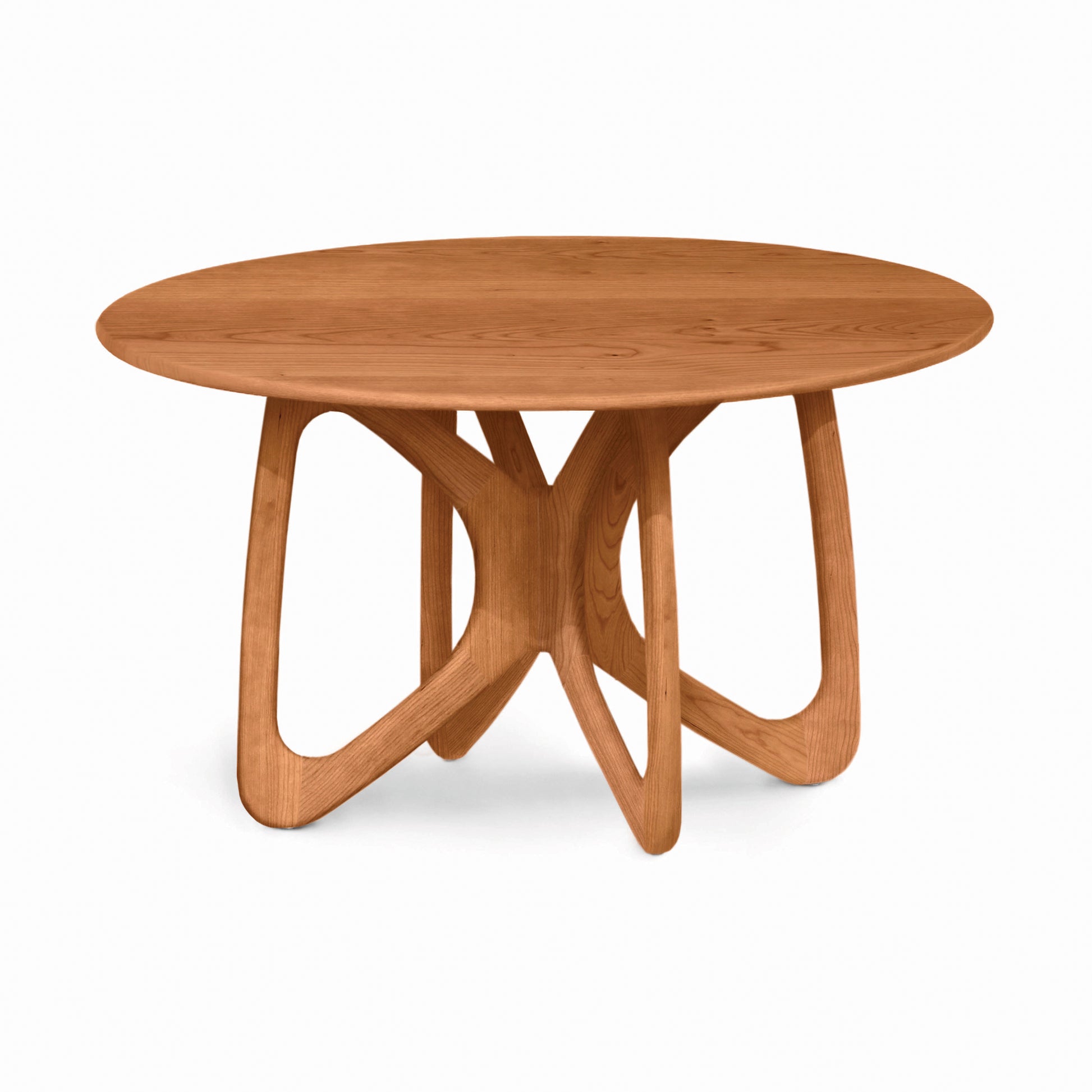 Copeland Furniture Butterfly Round Solid Top Dining Table with a sleek, seamless surface and four elegantly curved interlocking legs crafted in solid wood.