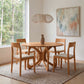 Copeland Furniture Butterfly Round Solid Top Dining Table with four matching chairs, crafted in America from premium wood, the centerpiece of the room.
