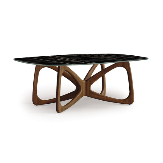 Modern Copeland Furniture Butterfly Table with sintered stone oval top and interlocking wooden base.