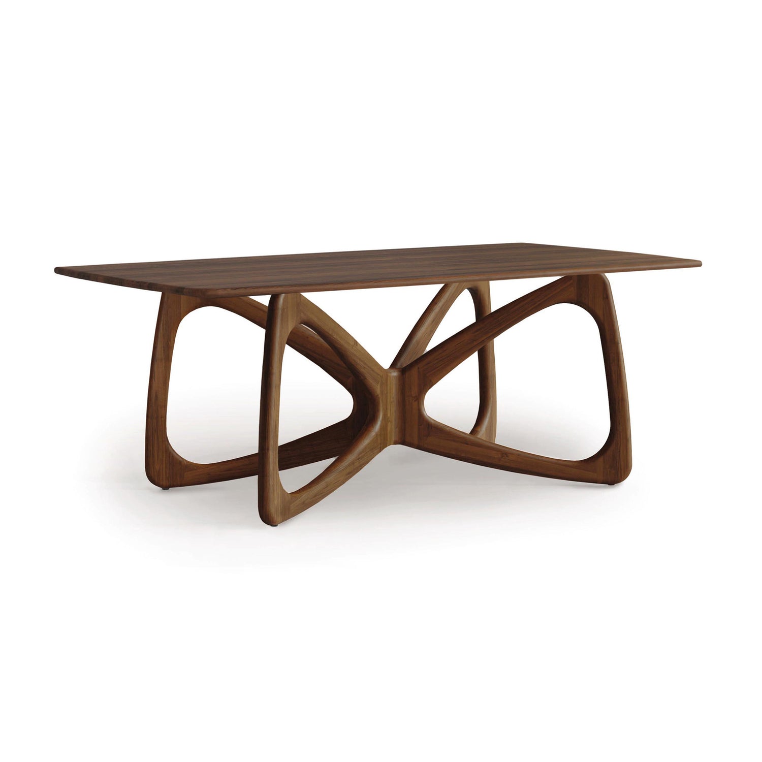 Introducing the Butterfly Solid Top Dining Table by Copeland Furniture, crafted from sustainably sourced hardwoods. This elegant wooden dining table features a rectangular top and a base with an intricate, looped design of interlocking curves, offering modern aesthetics while emphasizing its smooth finish and natural grain.