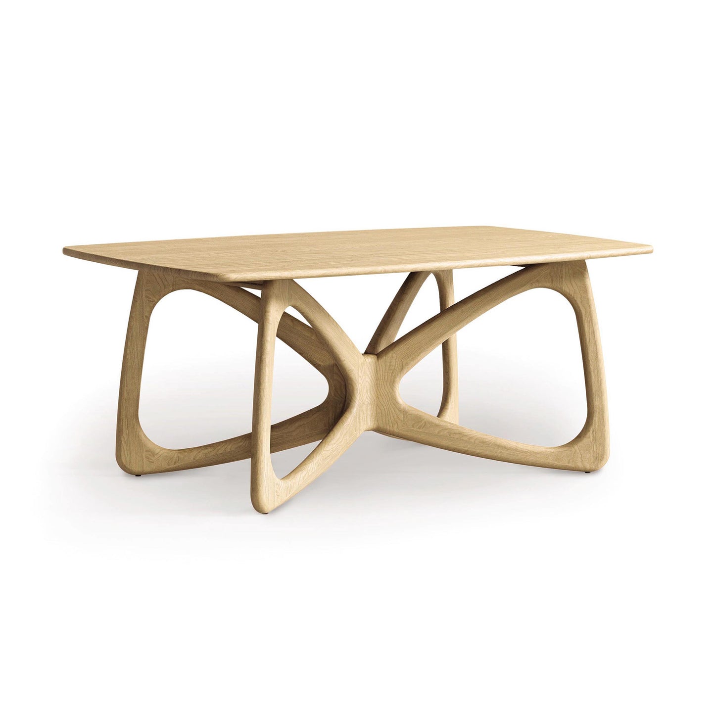 The Butterfly Solid Top Dining Table by Copeland Furniture is crafted from sustainably sourced hardwoods and features a rectangular top with an intricate, sculptural base made of interlocking, curved supports. Its natural finish highlights the grain against the plain white background, perfectly embodying modern aesthetics.