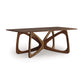 Copeland Furniture Butterfly Solid Top Dining Table with polished rectangular wooden surface and intricate sculptural design of interlocking curved legs. Made from sustainable North American hardwoods, this durable and stylish table fits modern aesthetics.