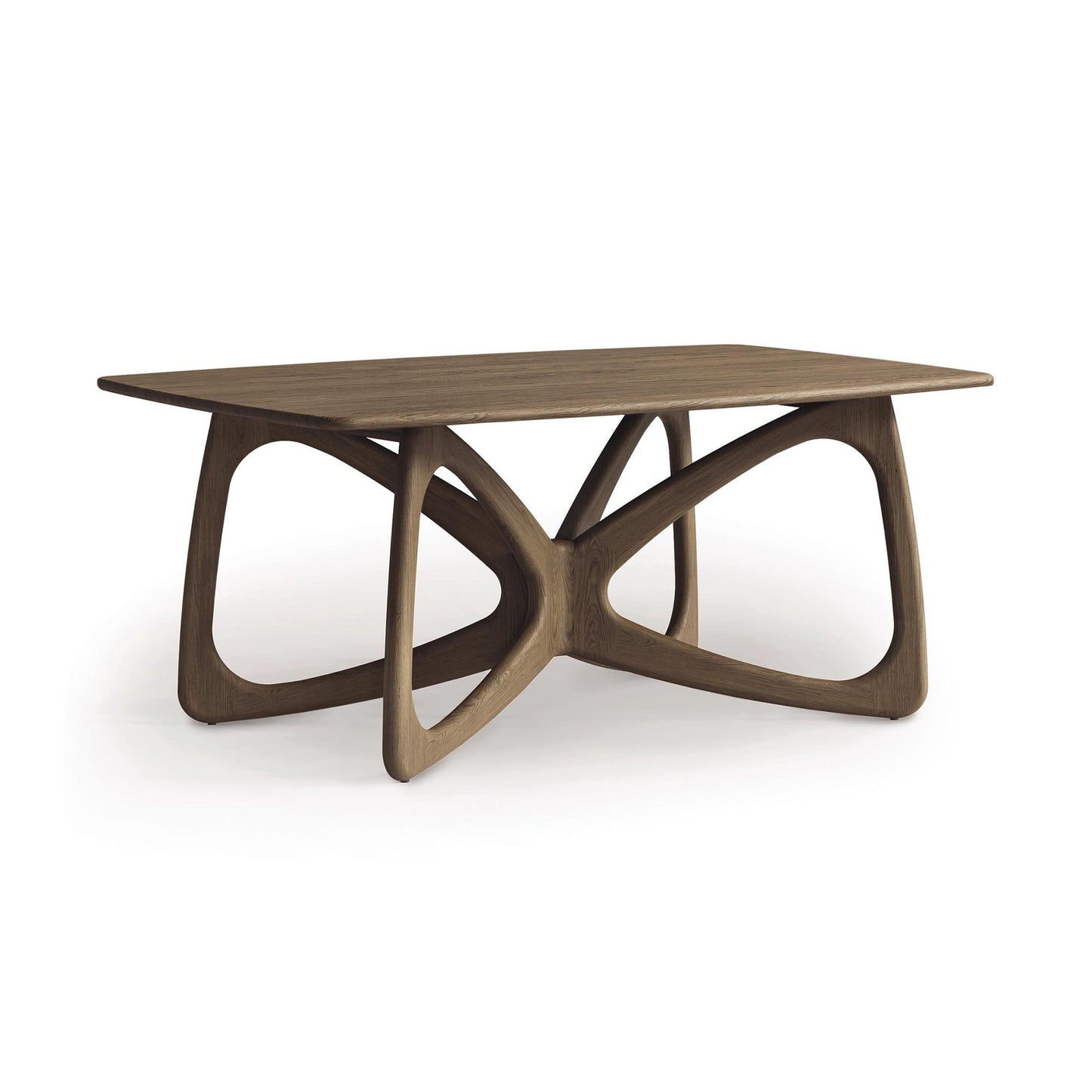 The Butterfly Solid Top Dining Table by Copeland Furniture features a rectangular wooden surface and an artistic base with elegantly curved, interconnected legs. Combining modern design with practicality, it is made from sustainably sourced hardwoods to offer an ideal fusion of style and eco-friendliness.