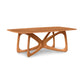 Butterfly Solid Top Dining Table by Copeland Furniture with rounded edges and intertwined base, expertly crafted from North American hardwoods.