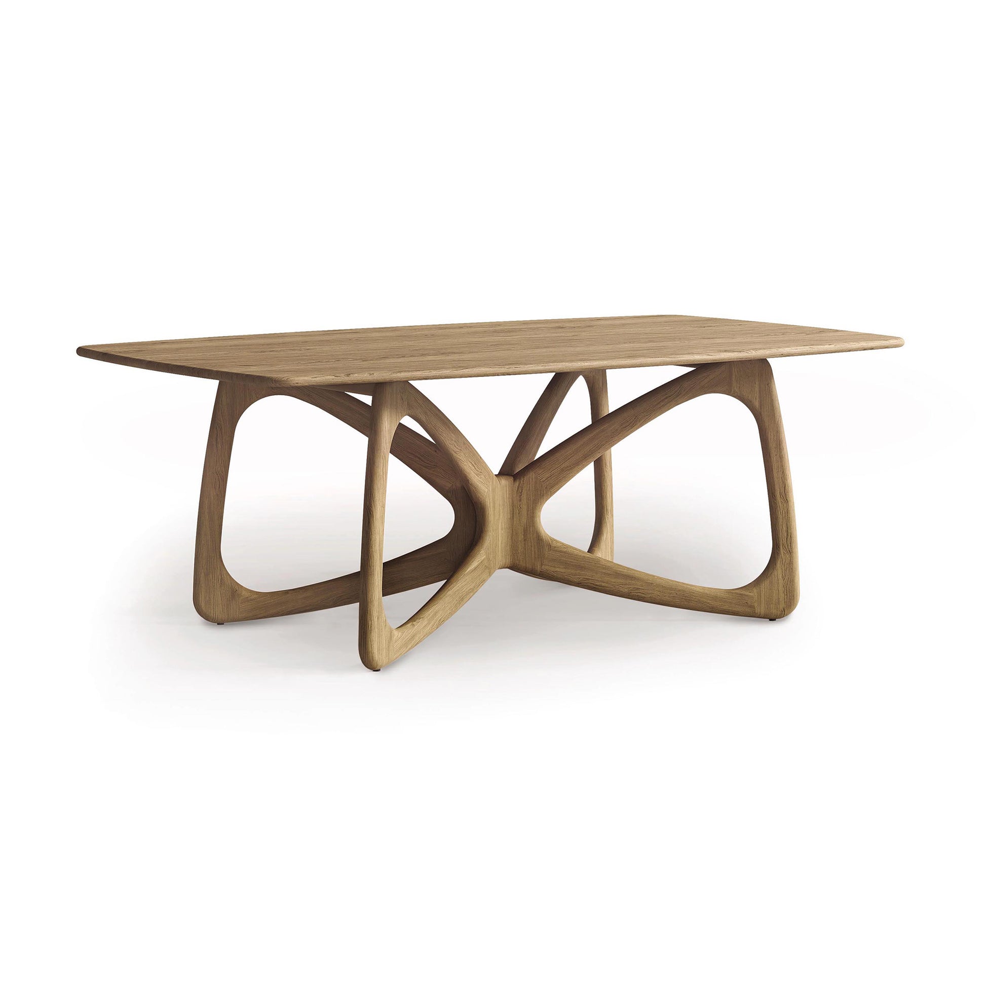 The Copeland Furniture Butterfly Solid Top Dining Table boasts a rectangular top supported by a unique curved, geometric base. Its light brown finish highlights the visible wood grain, capturing modern design elements. Made from sustainably sourced hardwoods, this artistic creation stands out against a plain white backdrop.