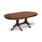 A Lyndon Furniture Cabriole Double Pedestal Extension Dining Table with four legs.