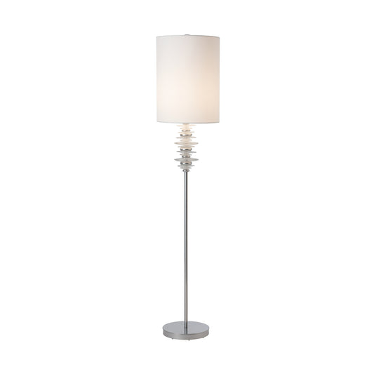 Cairn Floor Lamp by Hubbardton Forge with a white cylindrical shade, sleek metal pole, and hand-crafted stacked glass accents, made in the USA.