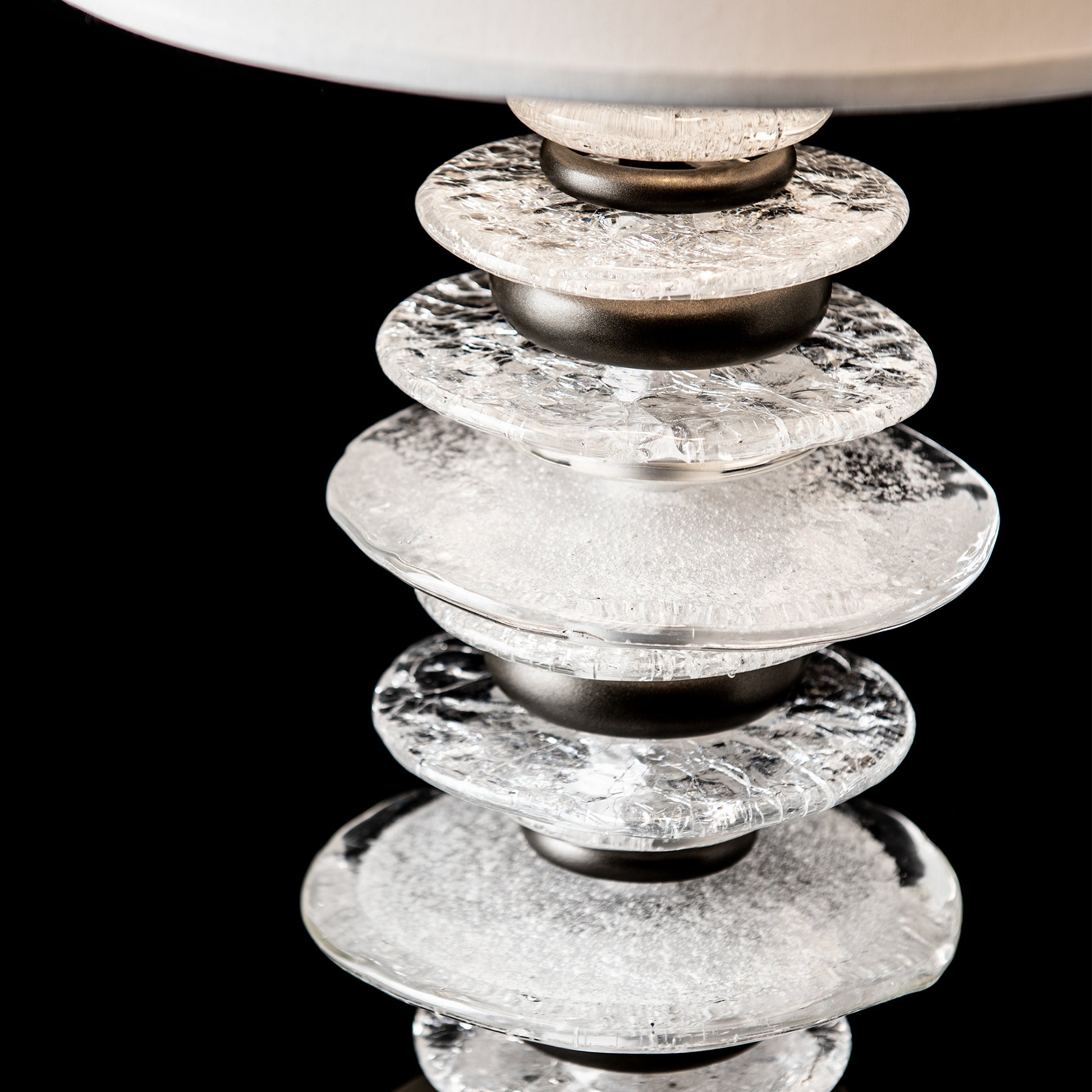 Hubbardton Forge Cairn Table Lamp with stacked textured glass discs and metal spacers, handcrafted by American artisans for Vermont Woods Studios.