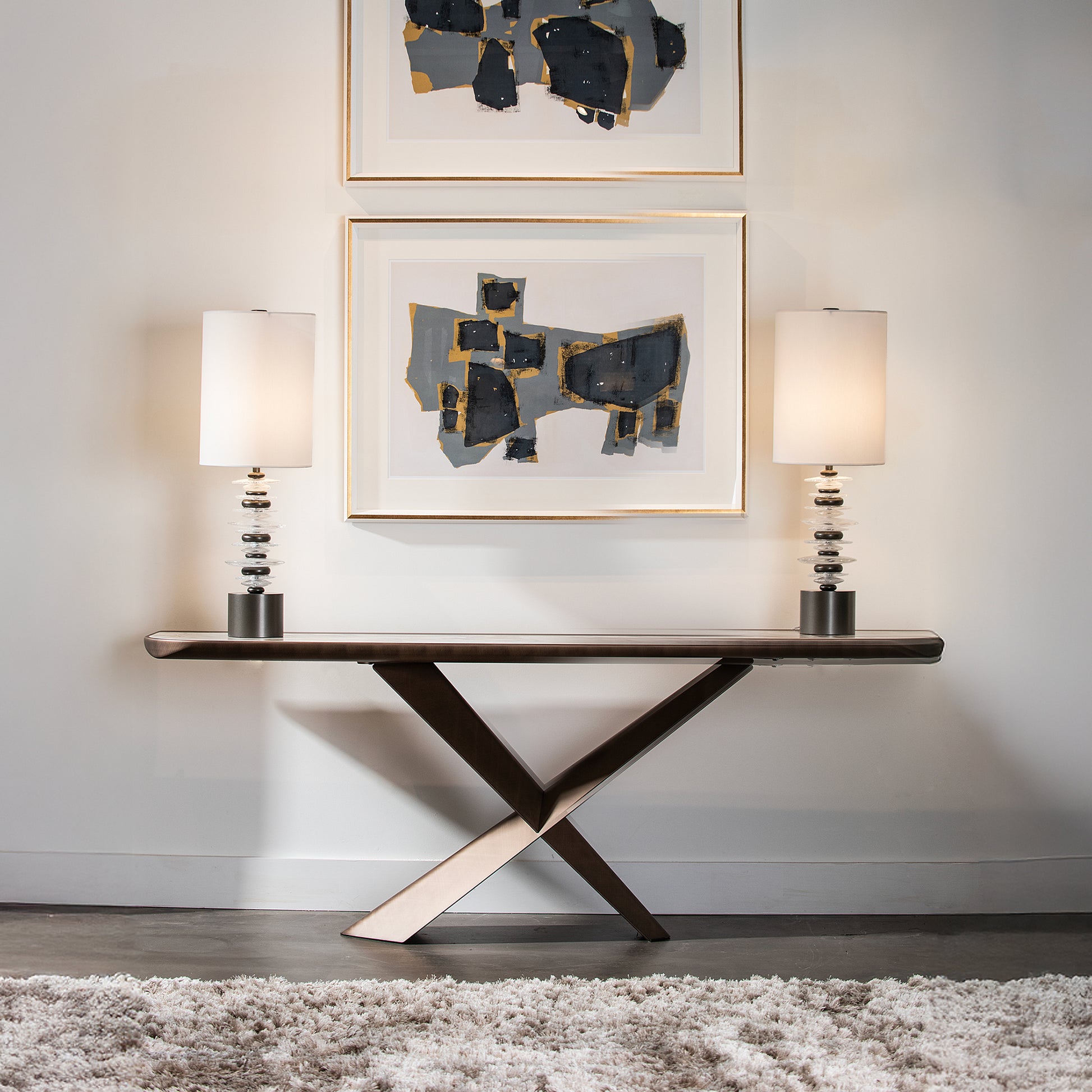 American made modern console table with crossed legs, crafted wood design; featuring Hubbardton Forge Cairn Table Lamps.