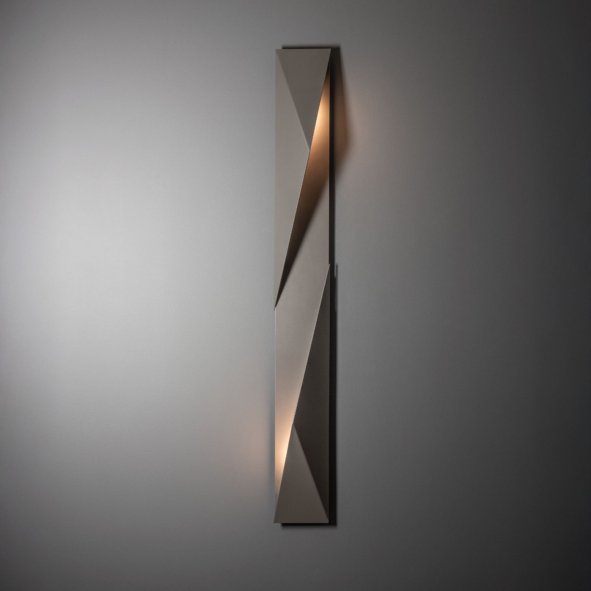 Carbon Large Outdoor Sconce by Hubbardton Forge, crafted from hand-forged steel, featuring a modern rectangular design and subtle up and down lighting.