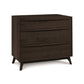 A modern bedroom's Copeland Furniture Catalina 3-Drawer Chest: a solid natural cherry dresser with angled legs.