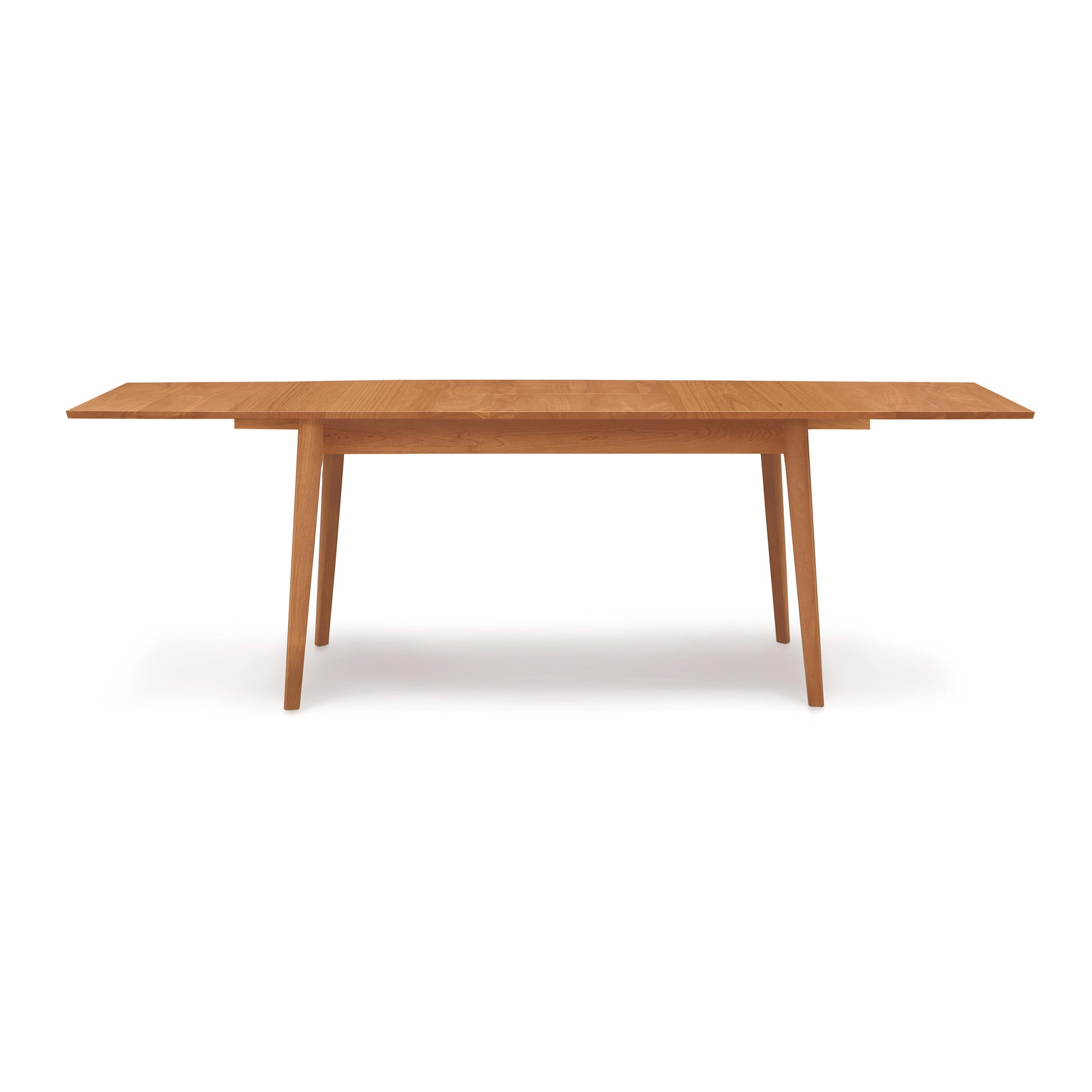 A Copeland Furniture Catalina Extension Table with a solid wood top.