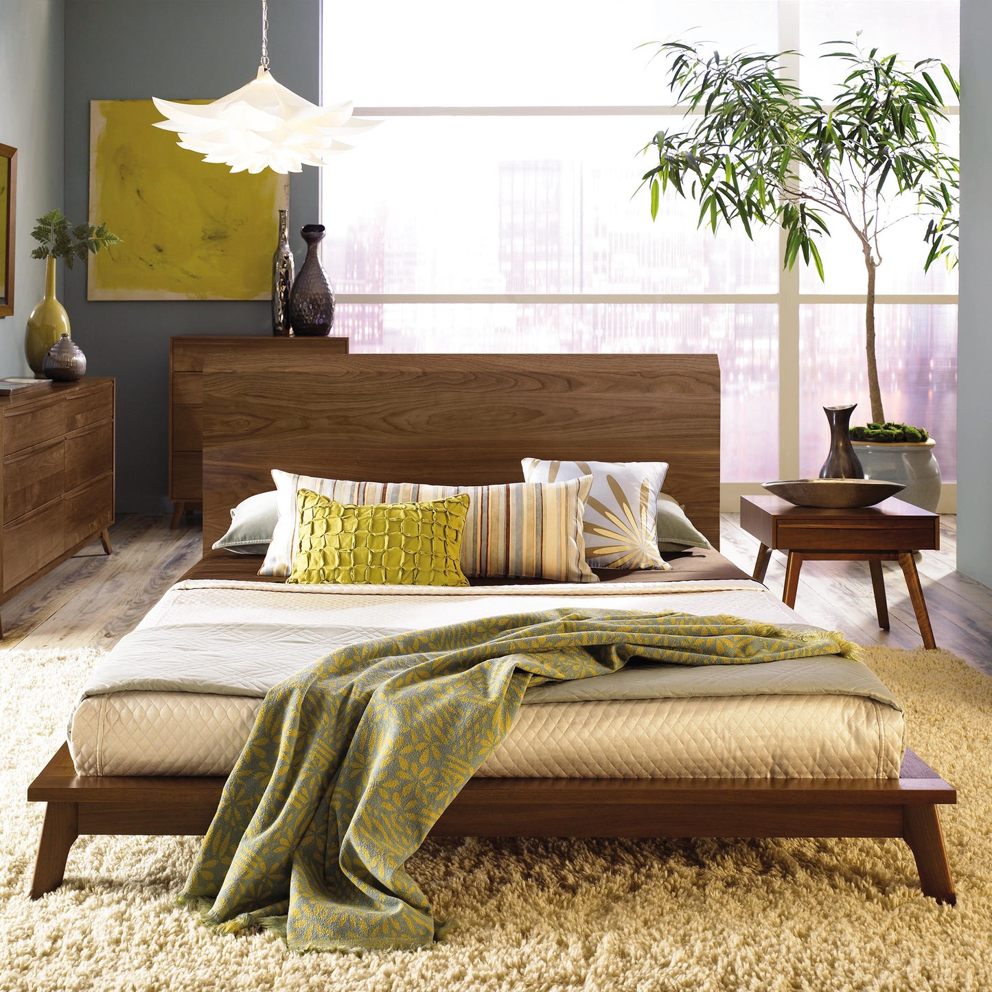 Copeland Furniture Catalina Platform Bed with green and yellow pillows, highlighting its sleek design.