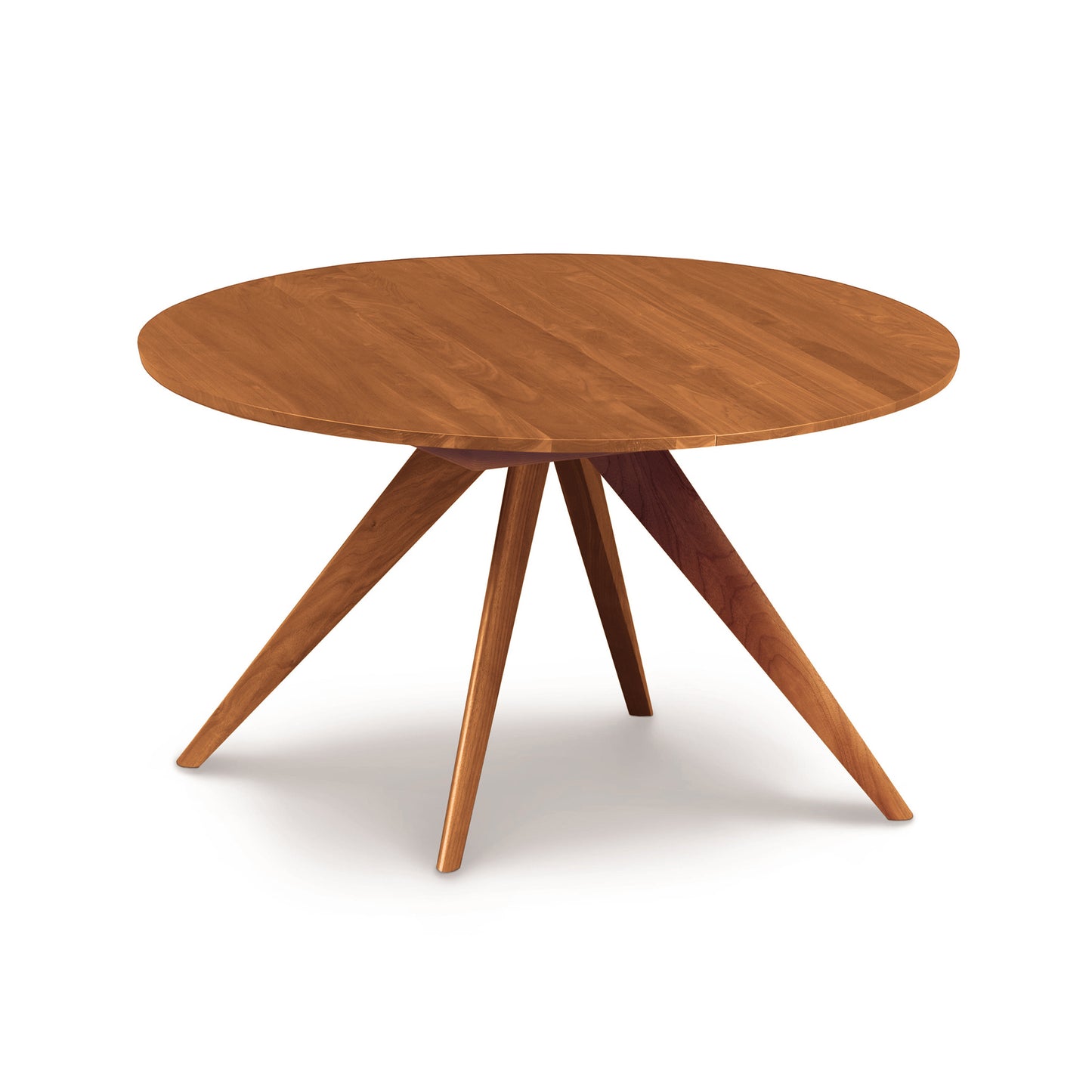 A fine dining Copeland Furniture Catalina Round Extension Table with four angled legs, crafted from solid North American wood and isolated on a white background.