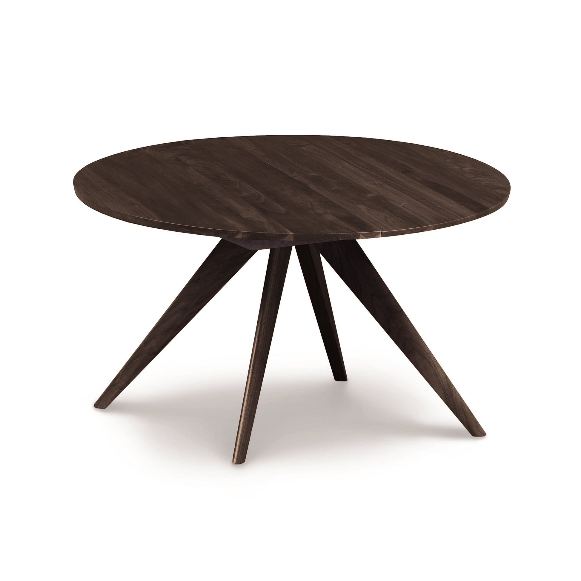 A round Copeland Furniture Catalina Round Extension Table, made of solid North American wood, with four angled legs on a white background.