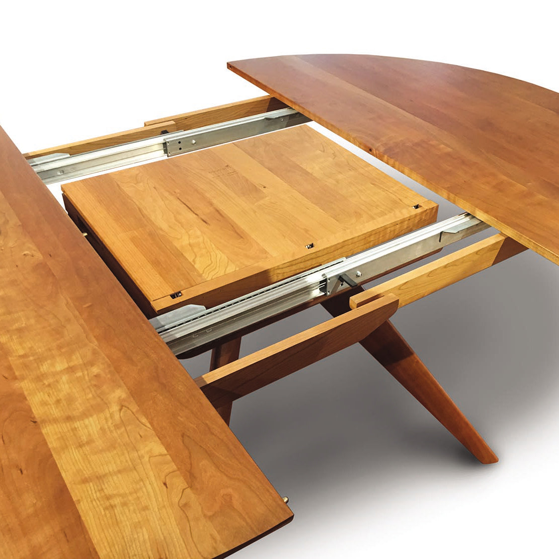 A wooden dining table with a sliding top.
