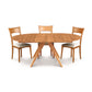 A solid North American wood Copeland Furniture Catalina Round Extension Table with four matching chairs on a white background.
