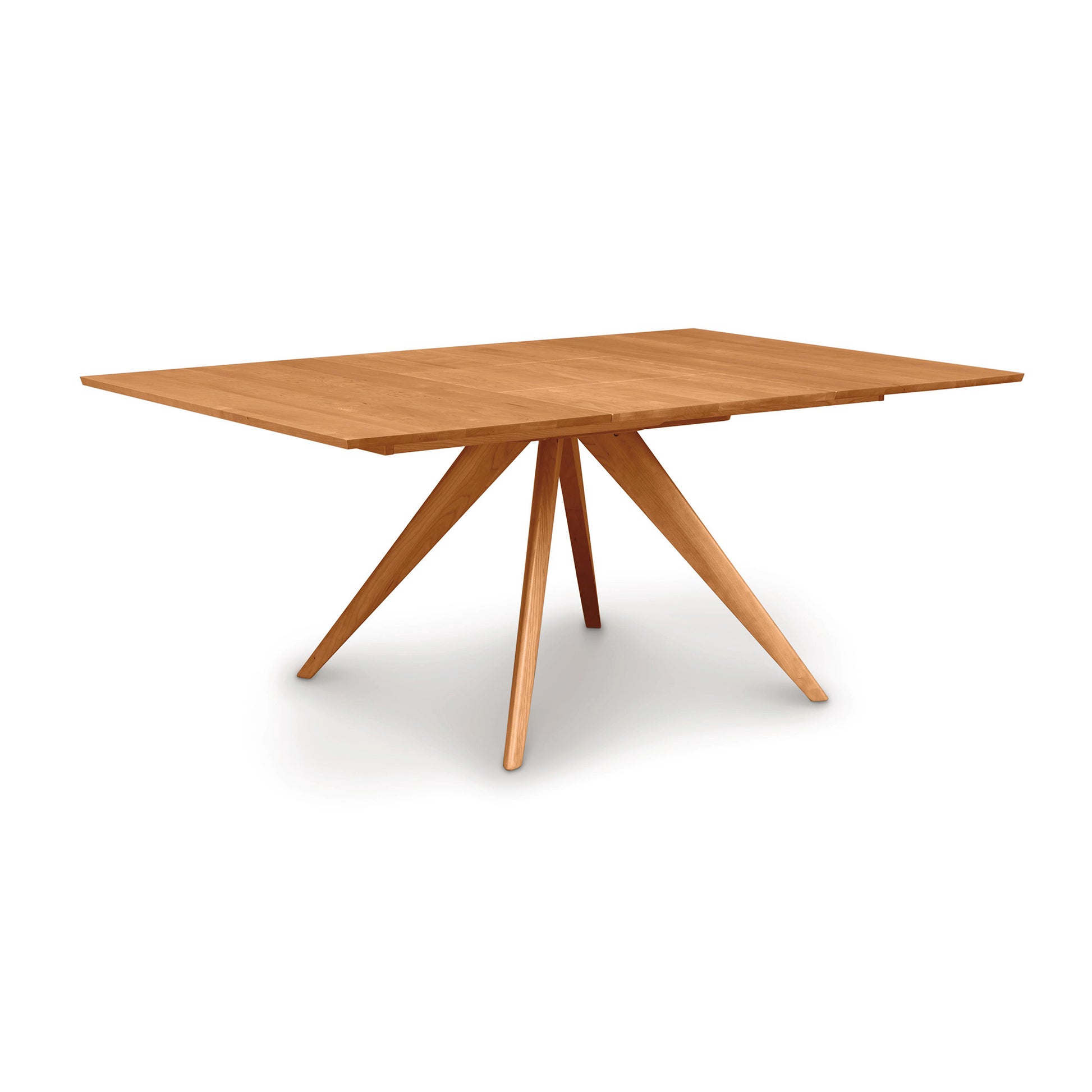 A Catalina Square Extension Dining Table crafted from sustainable hardwoods by Copeland Furniture, featuring a tapered, geometric base on a white background.