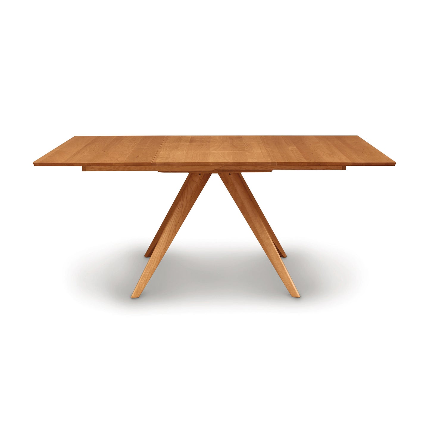 The Copeland Furniture Catalina Square Extension Dining Table showcases mid-century styling and is made from sustainably harvested wood. Expertly crafted with three legs, this wooden table adds a touch of elegance to any space and
