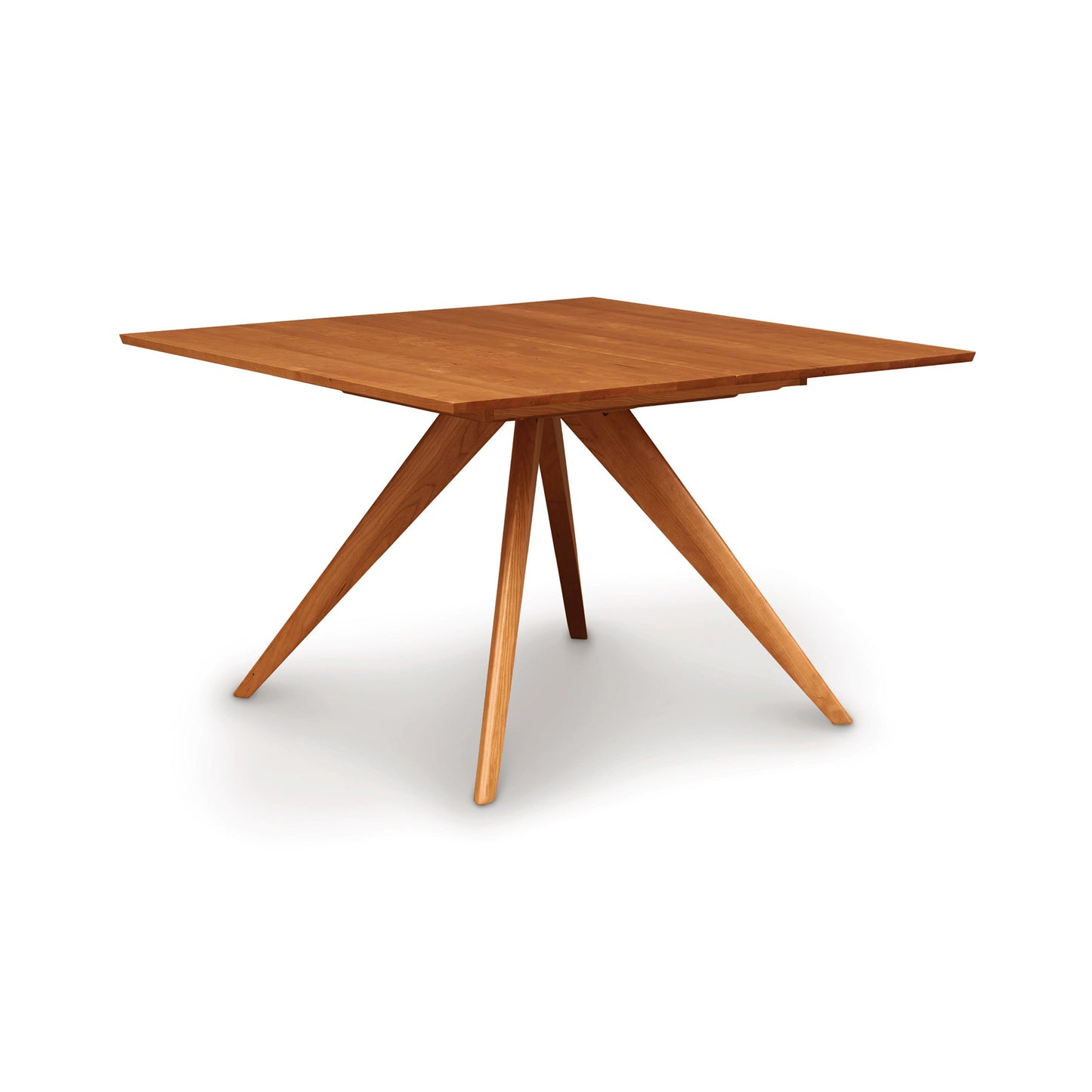 A Catalina Square Extension Dining Table by Copeland Furniture, made of sustainable hardwoods with a flat top and angular legs set on a white background.