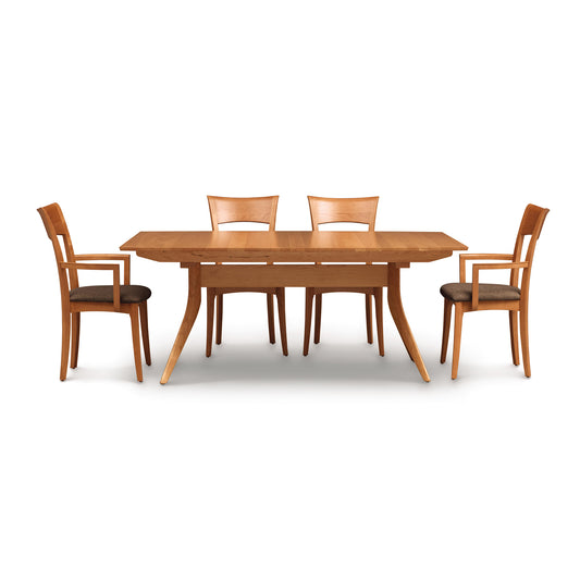 Solid American hardwood Catalina Trestle Extension Table with four matching chairs by Copeland Furniture on a white background.