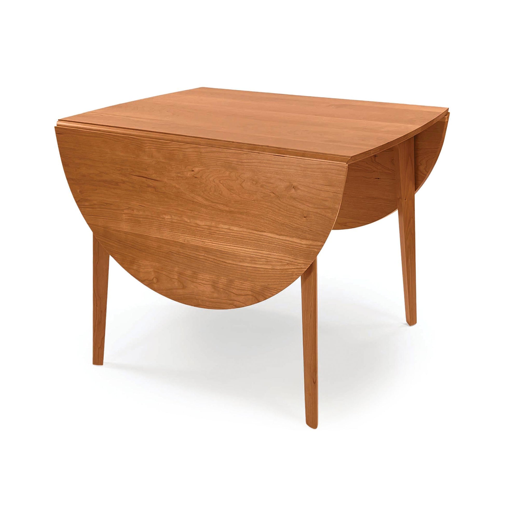 Catalina Drop-Leaf Dining Table by Copeland Furniture features American craftsmanship, foldable sides, and four straight legs in solid wood.