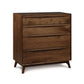A modern Copeland Furniture Catalina 4-drawer chest with angled legs, crafted from sustainable harvested woods, isolated on a white background.