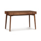 Copeland Furniture Catalina Desk with walnut finish, smooth surface, sleek tapered legs, and minimalist design without visible handles.