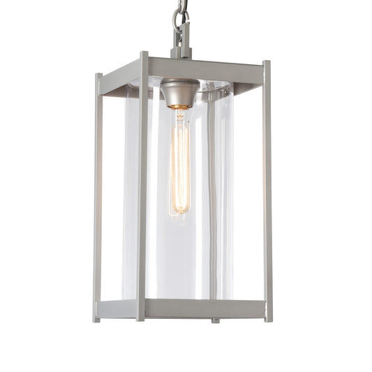 Cela Large Outdoor Lantern by Hubbardton Forge with metal frame, clear glass panels, and exposed bulb, showcasing modern outdoor lighting design.