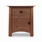 Cherry Moon 1-Drawer Nightstand with Door by Maple Corner Woodworks, crafted from solid wood with dark handles and sturdy legs, American made.