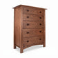 Cherry Moon 5-Drawer Chest by Maple Corner Woodworks, handcrafted in Vermont, features walnut wood, walnut handles, and rounded legs.