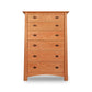 A Maple Corner Woodworks Cherry Moon 6-Drawer Chest on a white background, showcasing its beauty in furniture design.