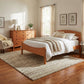 Maple Corner Woodworks Cherry Moon 8-Drawer Dresser and solid wood bed with white bedding featured in an American made bedroom furniture set.