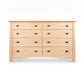 Cherry Moon 8-Drawer Dresser by Maple Corner Woodworks in light wood with dark handles, crafted in the USA from premium hardwood.
