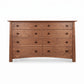 Cherry Moon 8-Drawer Dresser by Maple Corner Woodworks, crafted from solid wood with dark knobs, showcasing elegant American craftsmanship.