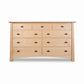 Cherry Moon 9-Drawer Dresser by Maple Corner Woodworks, handmade in Vermont, features a light wood finish with dark metal handles.