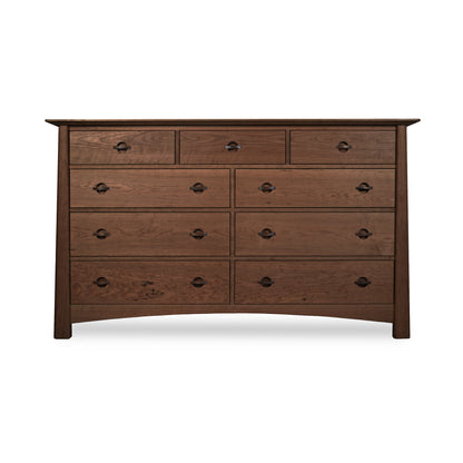 Cherry Moon 9-Drawer Dresser by Maple Corner Woodworks with dark metal handles, three small upper drawers and six spacious lower drawers; crafted from eco-friendly materials for a luxurious and sustainable bedroom centerpiece.